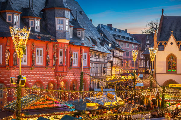 Historic buildings with Christmas lights at the market square in Goslar, Germany by Michael Abid