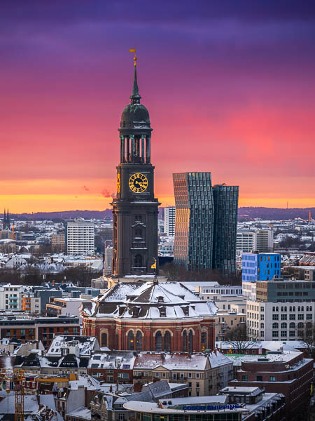 Michel (St. Michael's church) and the Dancing Towers in Hamburg, Germany during a winter sunset by Michael Abid