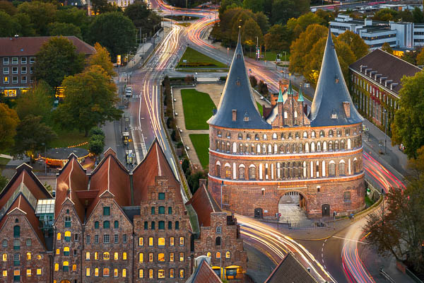 Holstentor in Lübeck, Germany on a autumn night by Michael Abid