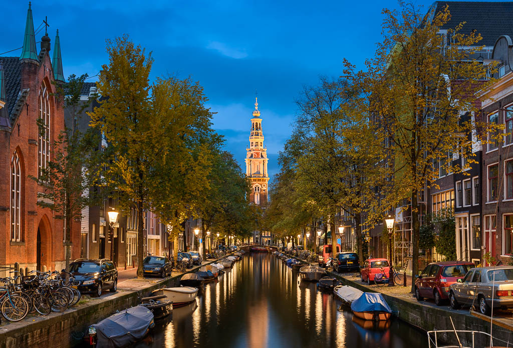 Canal and a church in Amsterdam at night