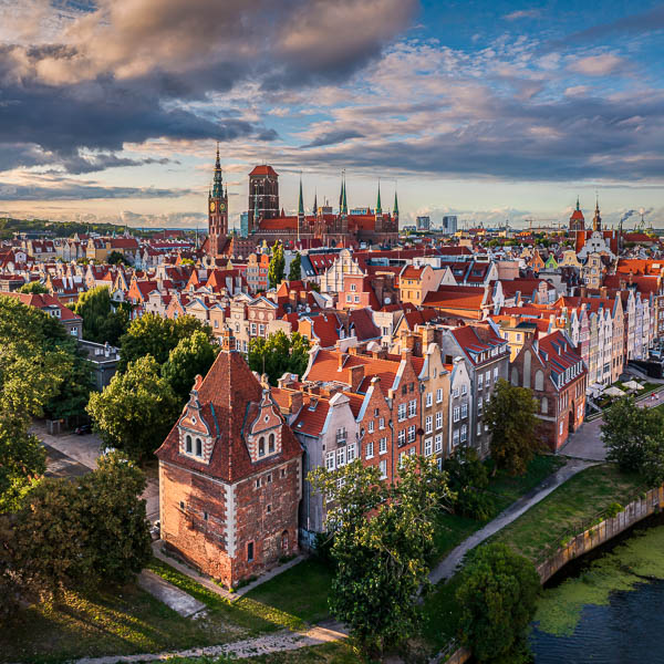 Aerial view of the old town with beautiful colorful buildings in Gdansk, Poland by Michael Abid